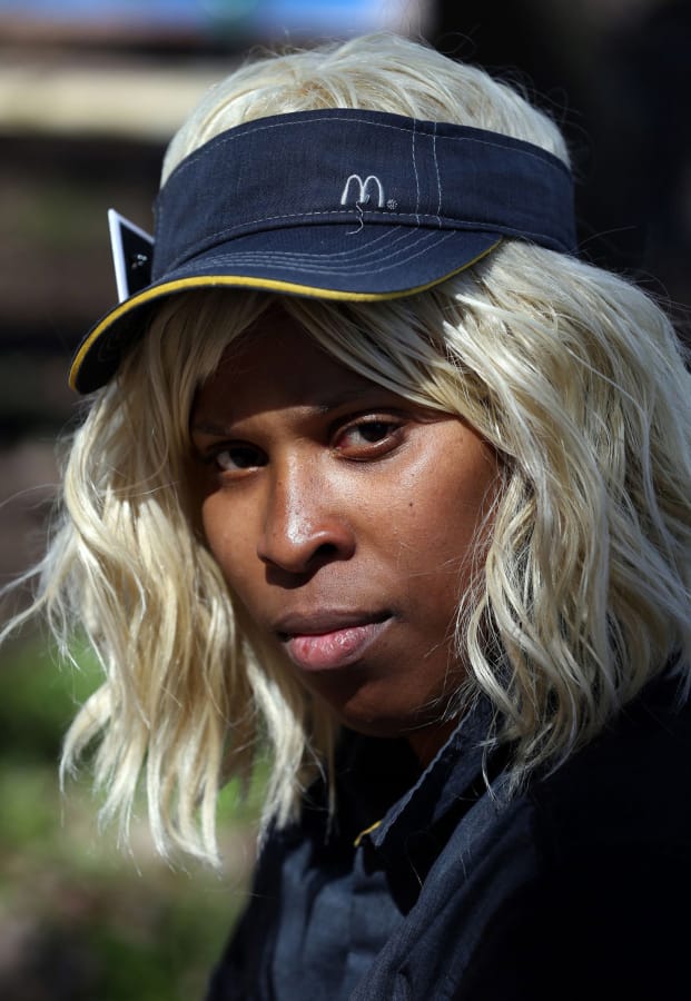 Ieshia Townsend works as a cashier in the drive-thru of a South Side McDonald&#039;s and has continued working through the COVID-19 virus pandemic.
