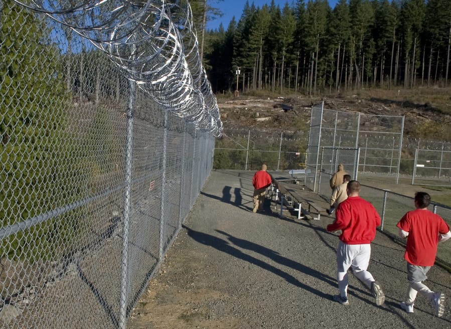 Inmates at Larch Corrections Center exercise in the yard in 2009.