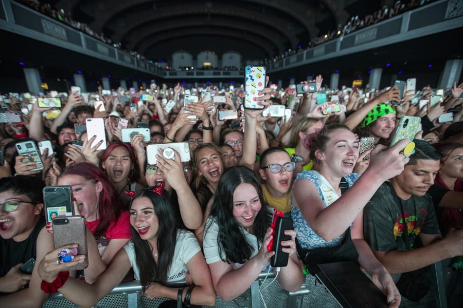 Fans cheer as Billie Eilish performs at the Shrine Auditorium in Los Angeles, Calif., in July. (Allen J.