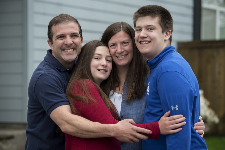 Stephen Flach of Vancouver, from left, his daughter, Lauren, 11, his wife, Courtney, and his son, Robert, 15, have tried to find the silver lining in the COVID-19 quarantine.