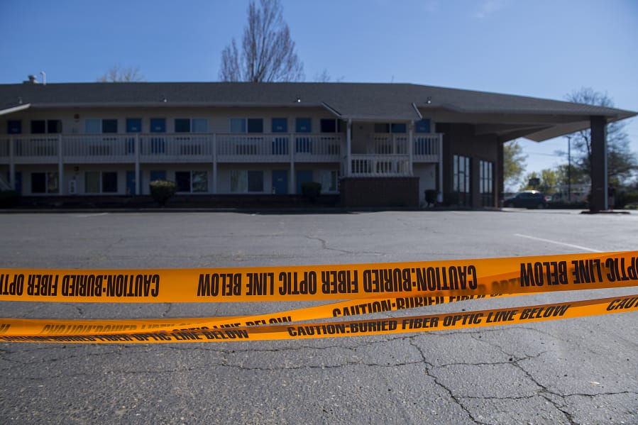 Caution tape surrounds one side of the Motel 6 at 221 N.E. Chkalov Drive in Vancouver.