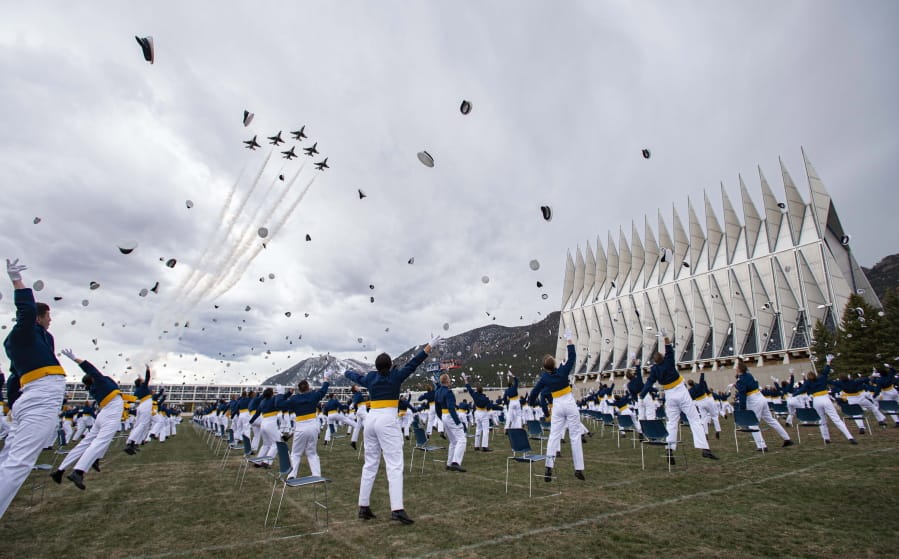 The class of 2020 toss their caps into the air as the Thunderbirds fly over Saturday, April 18, 2020, at the conclusion of the Air Force Academy graduation in Colorado Springs, Colo. Nearly 1,000 cadets graduated in a scaled-down ceremony due to the coronavirus pandemic. Saturday&#039;s commencement was attended by Vice President Mike Pence and capped a difficult final semester in which the cadets attended virtual classes and ate their meals alone in dorm rooms.