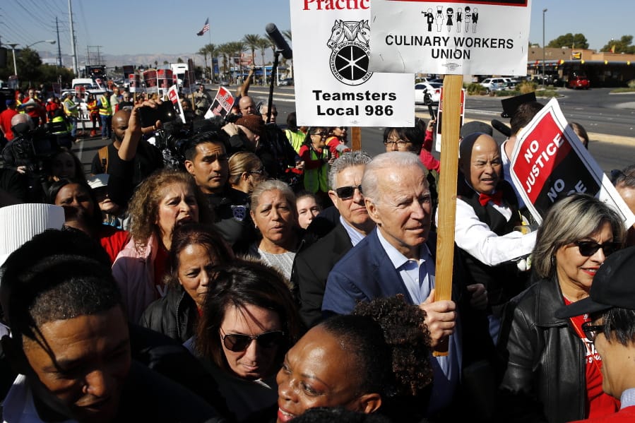 FILE - In this Feb. 19, 2020, file photo, Democratic presidential candidate former Vice President Joe Biden walks on a picket line with members of the Culinary Workers Union Local 226 outside the Palms Casino in Las Vegas. Biden&#039;s tenure as Barack Obama&#039;s vice president is complicating his efforts to deepen ties with Latinos who could be critical to winning the White House. For many Latinos, Biden&#039;s embrace of the Obama years is a frightening reminder of when the former president ejected about 3 million people living in the U.S.
