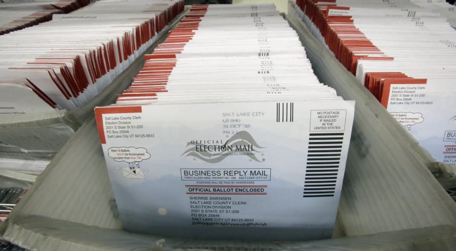 FILE - In this Nov. 1, 2016, file photo, mail-in ballots for the 2016 General Election are shown at the elections ballot center at the Salt Lake County Government Center, in Salt Lake City. As President Donald Trump rails against voting by mail, many members of his own political party are embracing it to keep their voters safe during the coronavirus outbreak.