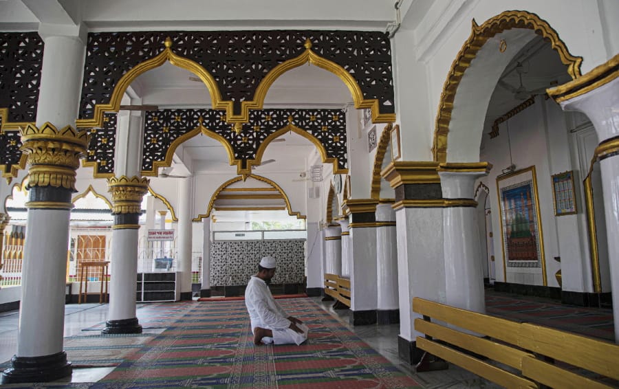 An Indian Muslim man prays in a Mosque during the nationwide lockdown to prevent the spread of new coronavirus in Gauhati, India, Monday, April 27, 2020. The U.S. Commission on International Religious Freedom is urging that the State Department add India to its list of nations with uniquely poor records on protecting freedom to worship, while proposing to remove Sudan and Uzbekistan from that list.