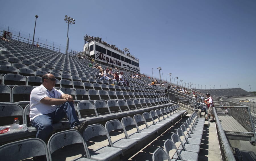 A few fans are shown in the grandstands to watch NASCAR practice in 2012 at Darlington Raceway in Darlington, S.C. NASCAR will get its season back on track starting May 17 at Darlington Raceway without spectators.