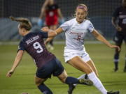 Washington State forward Morgan Weaver (6) was selected by the Portland Thorns with the second pick in the National Women&#039;s Soccer League draft. The league was supposed to start its season this weekend.