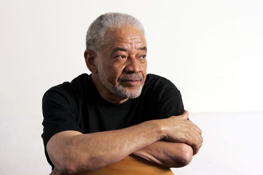 FILE - In this June 21, 2006 file photo, singer-songwriter Bill Withers poses in his office in Beverly Hills, Calif. Withers, who wrote and sang a string of soulful songs in the 1970s that have stood the test of time, including &quot;Lean On Me,&quot; &quot;Lovely Day&quot; and &quot;Ain&#039;t No Sunshine,&quot; died in Los Angeles from heart complications on Monday, March 30, 2020. He was 81.