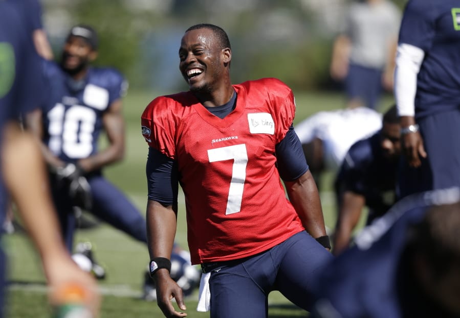 FILE - In this July 27, 2014, file photo, Seattle Seahawks quarterback Tarvaris Jackson smiles while stretching at an NFL football camp practice in Renton, Wash. Former NFL quarterback Tarvaris Jackson has died in a one-car crash outside Montgomery, Ala., authorities said Monday, April 13, 2020. He was 36. The 2012 Chevrolet Camaro that Jackson was driving went off the road, struck a tree and overturned at 8:50 p.m. Sunday, Trooper Benjamin &quot;Michael&quot; Carswell, an Alabama Law Enforcement Agency spokesman, said in a news release. Jackson was pronounced dead at a hospital.