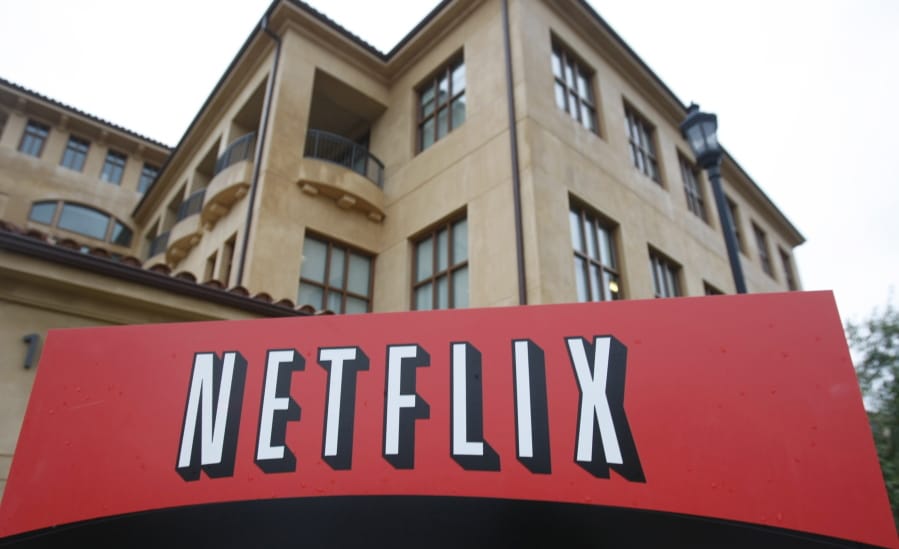 FILE - This Jan. 29, 2010, file photo, shows the company logo and view of Netflix headquarters in Los Gatos, Calif. COVID-19 may have knocked U.S. stocks into a bear market and pummeled the U.S.
