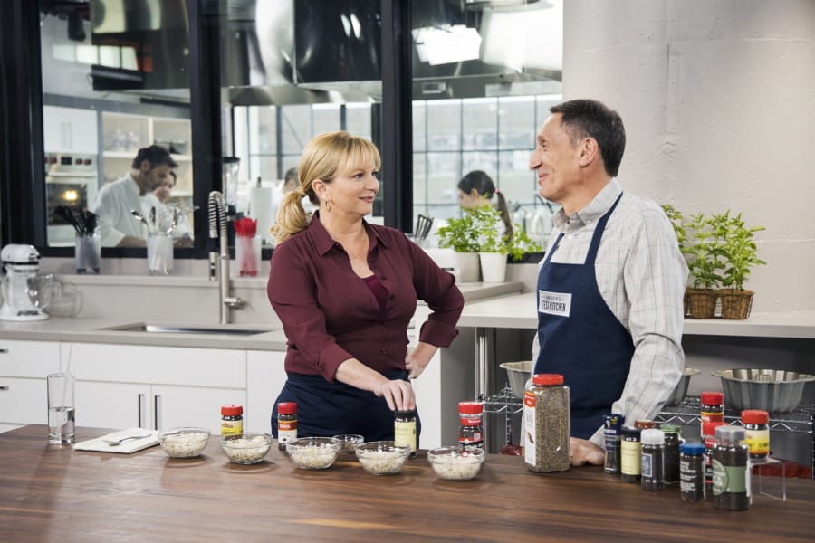 This undated image released by America&#039;s Test Kitchen shows host Bridget Lancaster, left, and Chief Creative Officer Jack Bishop from the series &quot;America&#039;s Test Kitchen.&quot; The series is marking its 20th year on PBS and mixing up a new batch of younger viewers who are drawn to the cooking show online.