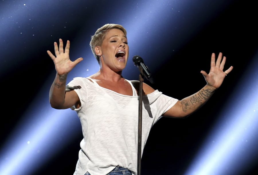 FILE - In this Jan. 28, 2018, file photo, Pink performs &quot;Wild Hearts Can&#039;t Be Broken&quot; at the 60th annual Grammy Awards at Madison Square Garden in New York. We are all learning a lot about each other these days and that&#039;s especially true with our celebrities. Social distancing has meant they have no army of publicists or glam squad. While many influencers and stars continue to post a flood of flattering, carefully stage-managed images, others are mirroring us -- unshaven, unwashed and not ashamed. &quot;When I drink, I get really, really brilliant ideas,&quot; the singer Pink confessed recently. &quot;And last night, I got an idea -- I can cut hair. I can totally cut hair. Why have I been paying people all this time?&quot; She then reveals some choppy, shaved spots on her head.