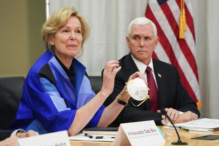 FILE - In this March 5, 2020, file photo, Dr. Deborah Birx, Ambassador and White House coronavirus response coordinator, holds a 3M N95 mask as she and Vice President Mike Pence visit 3M headquarters in Maplewood, Minn., in a meeting with the company&#039;s leaders and Minnesota Gov. Tim Walz to coordinate response to the COVID-19 coronavirus. On Friday, April 3, 2020, the manufacturing giant pushed back against criticism from Trump over production of face masks that are badly needed by American health care workers. 3M said the administration asked it to stop exporting medical-grade masks to Canada and Latin America, which the company said raises &quot;significant humanitarian implications&quot; and will backfire by causing other countries to retaliate against the U.S.