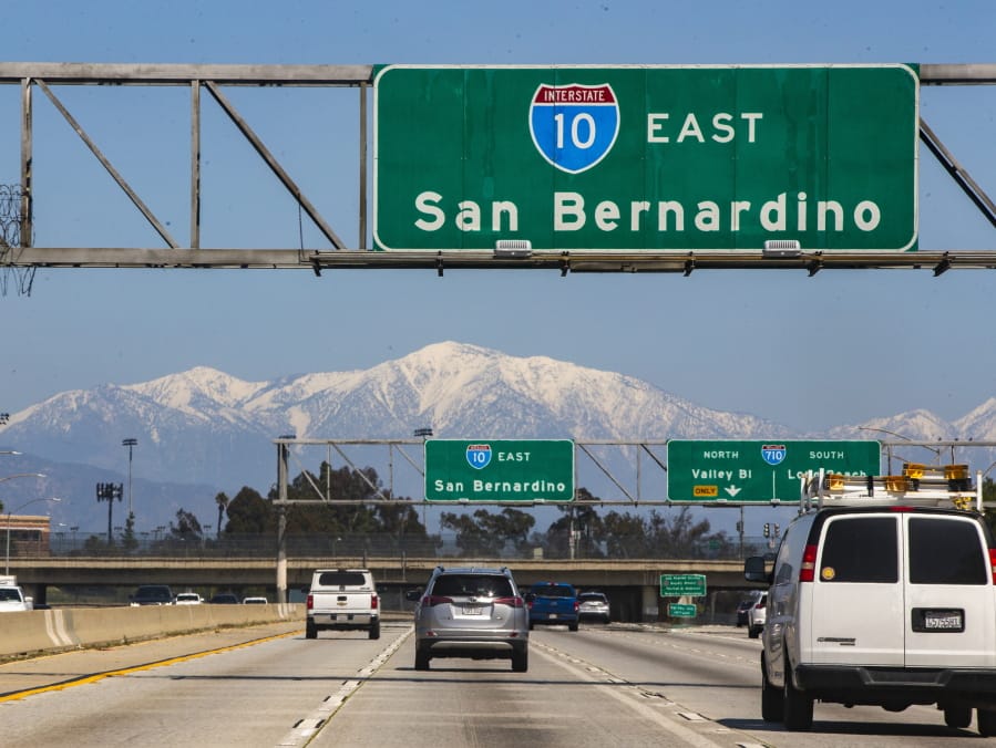 The San Gabriel Mountains are visible from Interstate 10 on March 30 in East Los Angeles. Improved air quality has resulted from business closures and recent rain in the area.