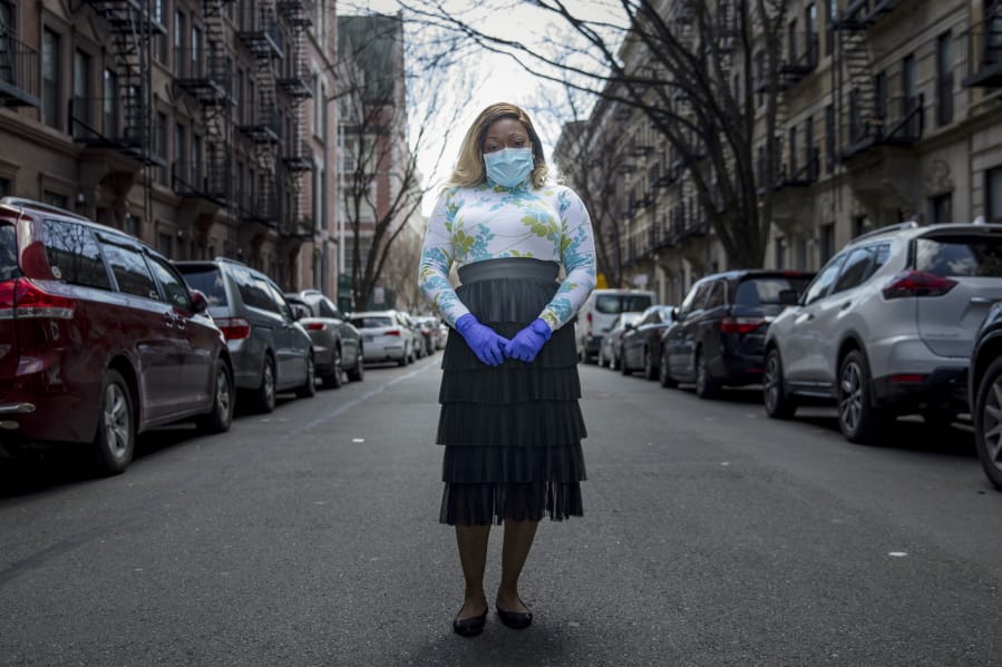 Tiffany Pinckney poses for a portrait in the Harlem neighborhood of New York on April 1, 2020. After a period of quarantine at home separated from her children, she has recovered from COVID-19. Pinckney became one of the nations first donors of &quot;convalescent plasma.&quot; Doctors around the world are dusting off a century-old treatment for infections: Infusions of blood plasma teeming with immune molecules that helped survivors beat the new coronavirus.