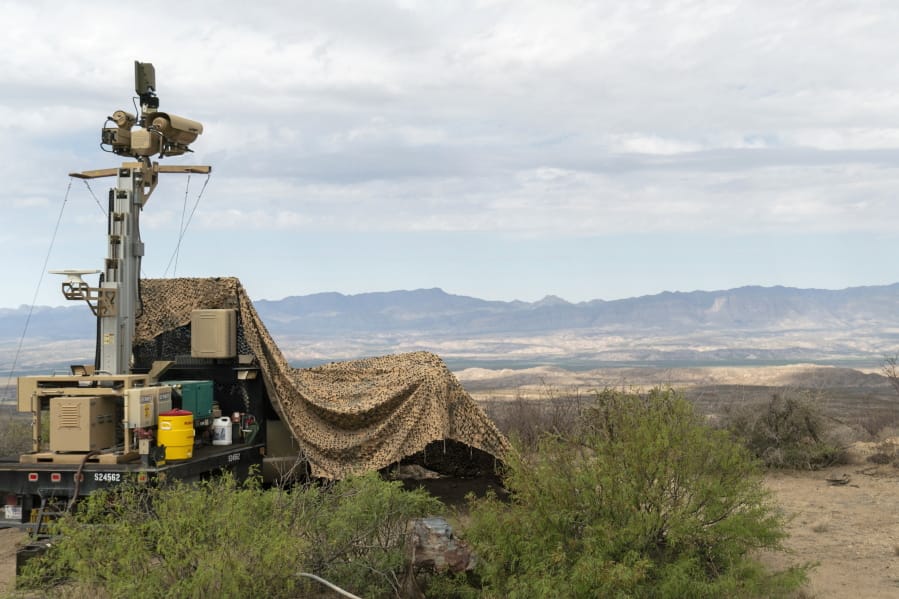 In this April 4, 2019 photo, provided by the U.S. Army, a mobile surveillance camera system manned by soldiers monitors a sector near the Presidio Border Patrol Station at Presidio, Texas. The Trump administration has been quietly adding military surveillance cameras at the U.S.-Mexico border in response to the novel coronavirus pandemic despite the fact fewer people appear to be crossing illegally. Documents obtained by The Associated Press show the Department of Defense at the request of the Department of Homeland Security sent 60 mobile surveillance cameras in addition to 540 more troops to the southwest border this month. (Sgt. Brandon Banzhaf/U.S.