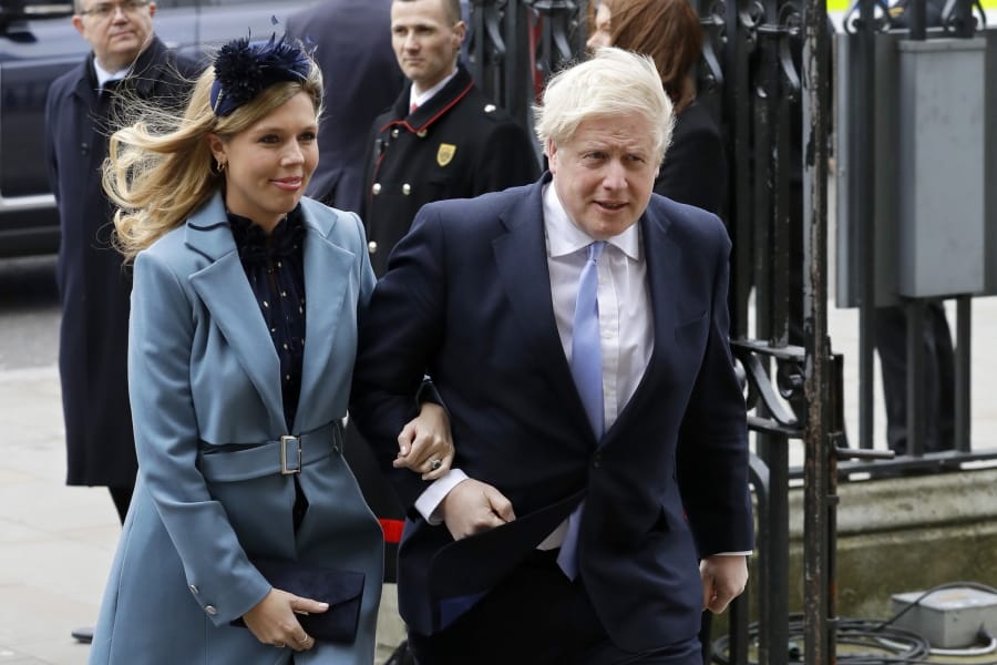 FILE - In this Monday, March 9, 2020 file photo Britain&#039;s Prime Minister Boris Johnson and his partner Carrie Symonds arrive to attend the annual Commonwealth Day service at Westminster Abbey in London.  Boris Johnson and his partner Carrie Symonds have announced she gave birth to a &quot;healthy baby boy at a London hospital earlier this morning&quot; Wednesday April 29, 2020, and both mother and baby are doing well.