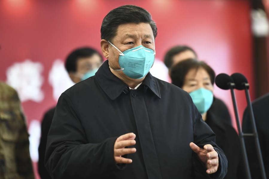 In this Tuesday, March 10, 2020, photo released by China&#039;s Xinhua News Agency, Chinese President Xi Jinping talks by video with patients and medical workers at the Huoshenshan Hospital in Wuhan in central China&#039;s Hubei Province. Top Chinese officials secretly determined they were likely facing a pandemic from a novel coronavirus in mid-January, ordering preparations even as they downplayed it in public. Internal documents obtained by the AP show that because warnings were muffled inside China, it took a confirmed case in Thailand to jolt Beijing into recognizing the possible pandemic before them.