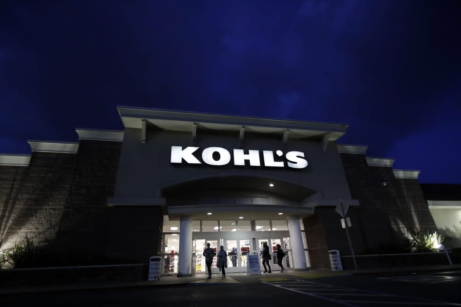 FILE - In this Nov. 29, 2019, file photo, customers walk outside of a Kohl&#039;s store in Colma, Calif. Macy&#039;s, Kohl&#039;s and Gap Inc. all said Monday, March 30, 2020, they will stop paying tens of thousands of employees who were thrown out of work when the chains temporarily closed their stores and sales collapsed as a result of the pandemic.