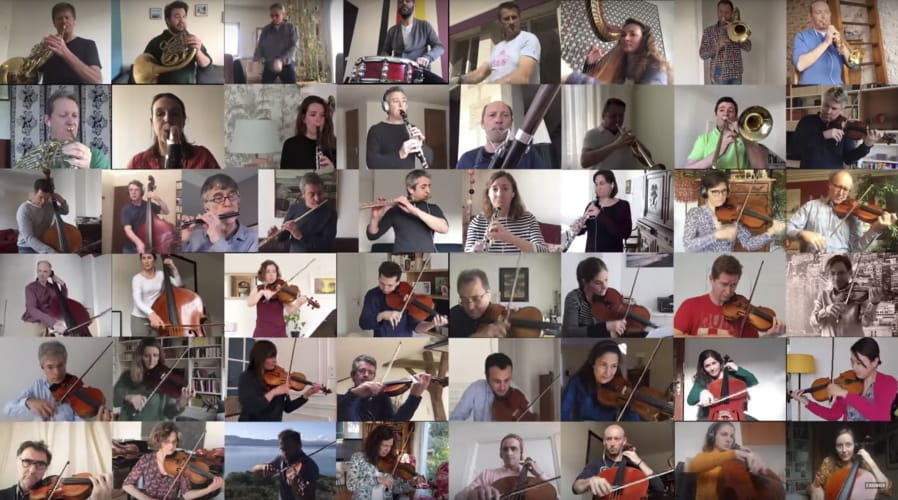 In this handout photo provided by the National Orchestra of France on Wednesday April 1, 2020, musicians from the National Orchestra of France are shown in the screenshot as a patchwork, each performing parts of &quot;Bolero&quot; alone in lockdown. The musicians recorded themselves over several days in March for this video posted by the orchestra on March 29. With the magic of technology, their individual videos were woven together to create a rousing orchestra-like sound for the famous piece of music by French composer Maurice Ravel.