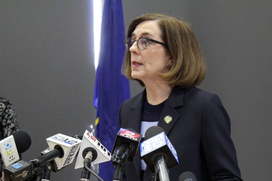 FILE - In this March 16, 2020, file photo, Oregon Gov. Kate Brown speaks at a news conference in Portland, Ore., to announce a four-week ban on eat-in dining at bars and restaurants, due to COVID-19, throughout the state. Oregon is in its fourth week of lockdown. Oregonians can&#039;t enter state parks in mountains and in valleys now blooming with springtime flowers, or go to the state&#039;s trademark wineries and microbreweries. But Oregon appears to be an outlier as coronavirus cases start to peak in each state. Of all the states in America, Oregon should have the fewest COVID-19 deaths per capita when the peak comes here, according to researchers at the University of Washington who developed a closely watched model.