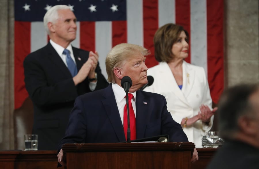 FILE - In this Feb. 4, 2020, file photo, President Donald Trump look to the first lady&#039;s box before delivering his State of the Union address to a joint session of Congress in the House Chamber on Capitol Hill in Washington,  as Vice President Mike Pence and Speaker Nancy Pelosi watch. Trump and Pelosi have not spoken in five months at a time when the nation is battling its worst health crisis in a century.
