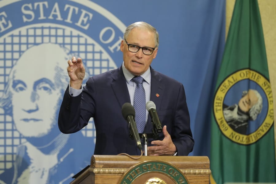 Washington Gov. Jay Inslee speaks during a news conference Monday, April 13, 2020, at the Capitol in Olympia, Wash. Inslee, along with California Gov. Gavin Newsom and Oregon Gov. Kate Brown, announced Monday that they will work together to re-open their economies while continuing to control the spread of COVID-19. (AP Photo/Ted S.