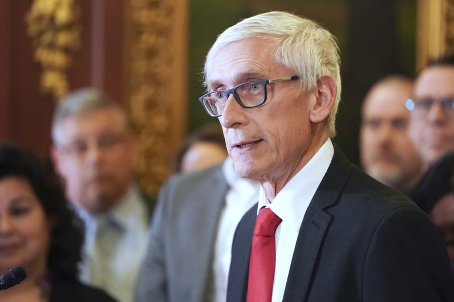 FILE - In this Feb. 6, 2020 file photo, Wisconsin Gov. Tony Evers holds a news conference in Madison, Wis. Wisconsin Democratic Gov. Tony Evers&#039; administration is moving ahead with plans to buy 10,000 ventilators and 1 million protective masks in the fight against the coronavirus. The effort comes after Evers&#039; administration had clashed with Republican lawmakers over whether he needed their permission to make such purchases.