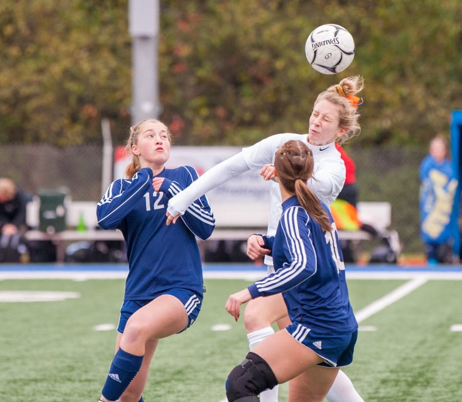Ridgefield&#039;s Brooke Weese heads the ball over Selah defenders in the 2A third-place match last fall. The one-time Concordia commit will now play collegiate soccer at Humboldt State due to Concordia&#039;s closure in February.