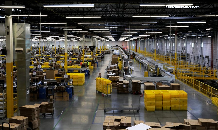 Amazon&#039;s immense multi-level warehouse, called a fulfillment center, in Kent, Wash.