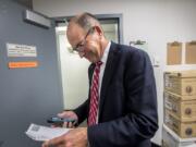 Clark County Auditor Greg Kimsey views the first primary election result printout in the ballot tabulation room of the Clark County Election Office in August.