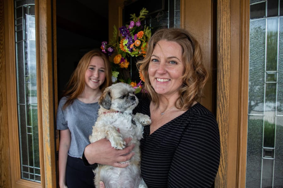 Caroline Hanna with daughter Jillian, 16, and their dog Benny at home in Mokena, Ill., on May 8. Hanna and her daughter tried to adopt an Australian shepherd puppy and sent $250 for a dog that didn&#039;t arrive.