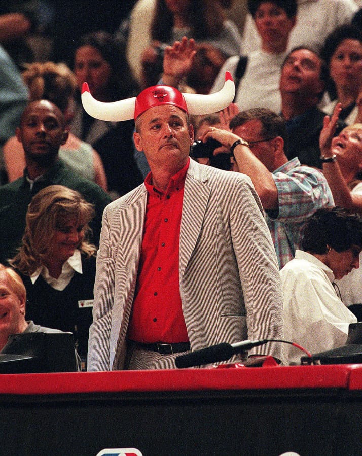 Bill Murray cheers for the Chicago Bulls as they play against the Indiana Pacers on May 31, 1998, at the United Center in Chicago.