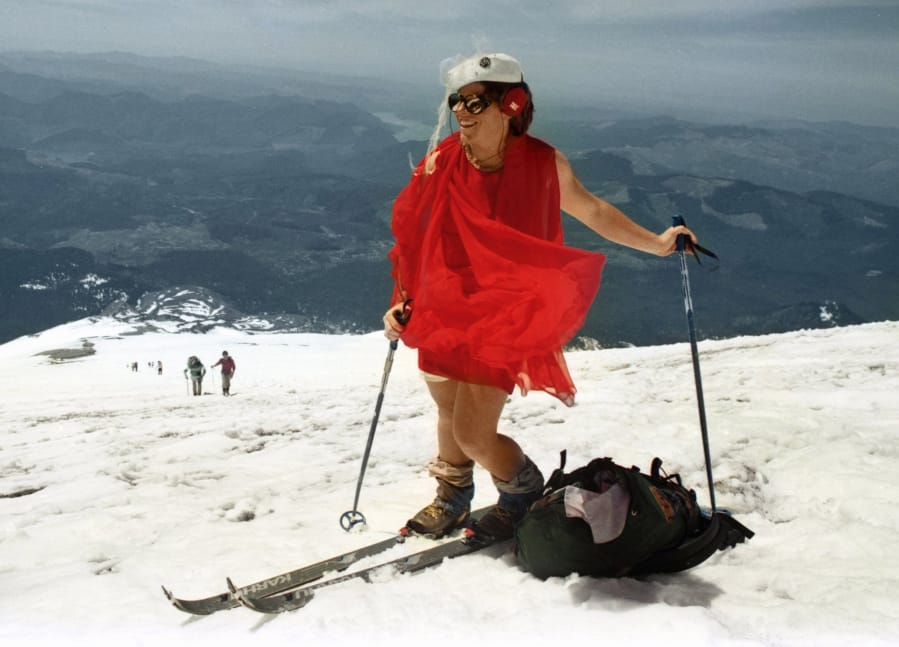 Kathy Phibbs climbed the Mount St. Helens wearing a red chiffon dress and a pillbox hat.
