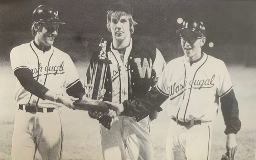 Washougal baseball coach Frank Jackson, left, and juniors Tim Wysaske and Russ Barber celebrate winning the 1973 Class A baseball state title in Wenatchee. The WIAA instituted a state baseball playoff system in 1973, and Washougal won three championships in six years.