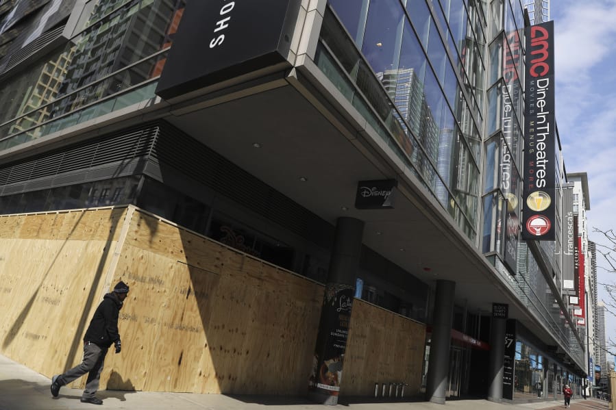 The closed AMC theaters at Block Thirty Seven on State Street in Chicago are partially border up amid the coronavirus pandemic on April 3, 2020.