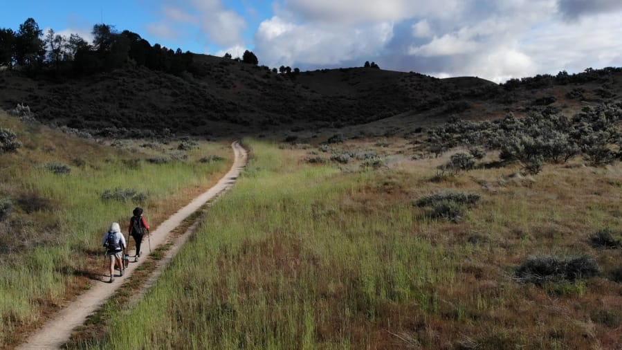 Blythe Fortin and Angie Diggs begin May 15 hiking Veterans Trail into the Dry Creek area of the Boise Foothills.