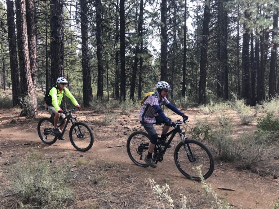 Mountain bikers ride the Catch and Release Trail southwest of Bend, Ore.