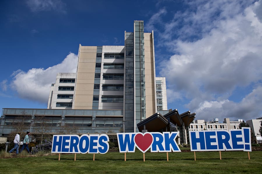 A sign outside PeaceHealth Southwest Medical Center honors hospital staff working hard to treat patients during the COVID-19 crisis.