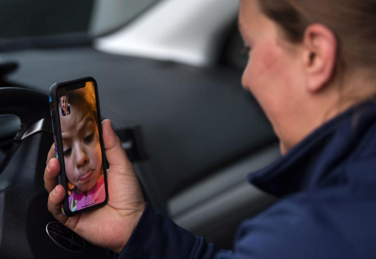 Teresa Chamberlain&#039;s daughter Olyn, 5, becomes emotional as Chamberlain video calls her from the parking lot after her shift at PeaceHealth Southwest Medical Center. &quot;I hope you don&#039;t die from the germ because I will miss you,&quot; Olyn said to her mother. &quot;Even when I&#039;m not by you, I&#039;m in your heart,&quot; Teresa told her.