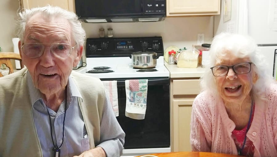 Lyle and Alice Leach, who just celebrated their 72nd anniversary, share a laugh at home.