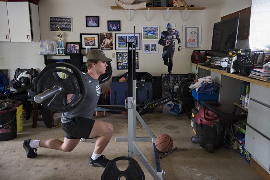 Mountain View's Riley McCarthy powers through his at-home training regimen in his family's garage Monday afternoon, May 11, 2020.