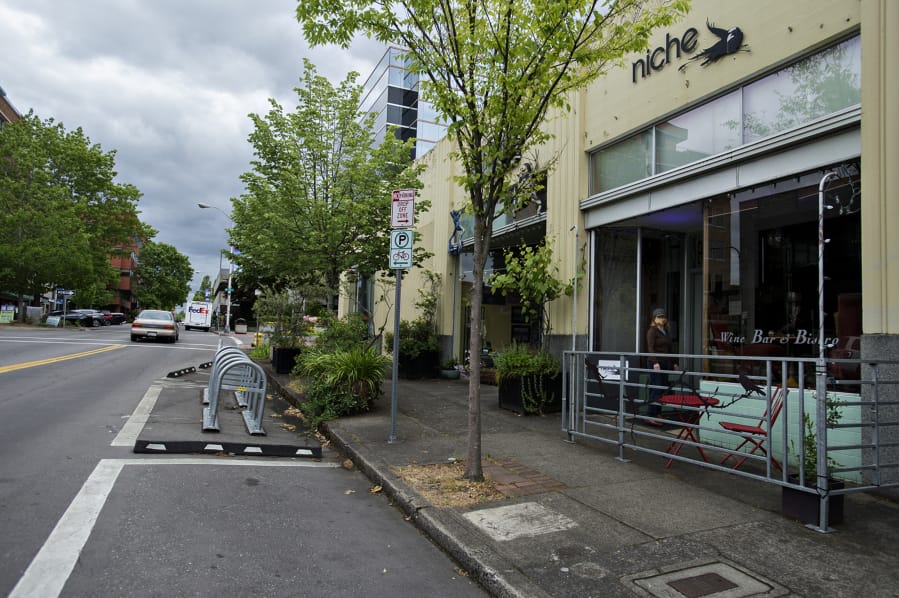 The city may allow outdoor seating in parking/loading zones, foreground center, in front of businesses such as Niche Wine Bar in downtown Vancouver.