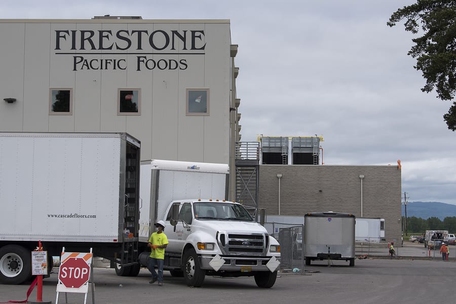 Work continues at Firestone Pacific Foods along Fruit Valley Road, after 69 employees of the plant tested positive for COVID-19. The facility has been allowed to continue some its production. There are 69 confirmed cases in facility employees and 15 confirmed cases in close contacts of those employees.