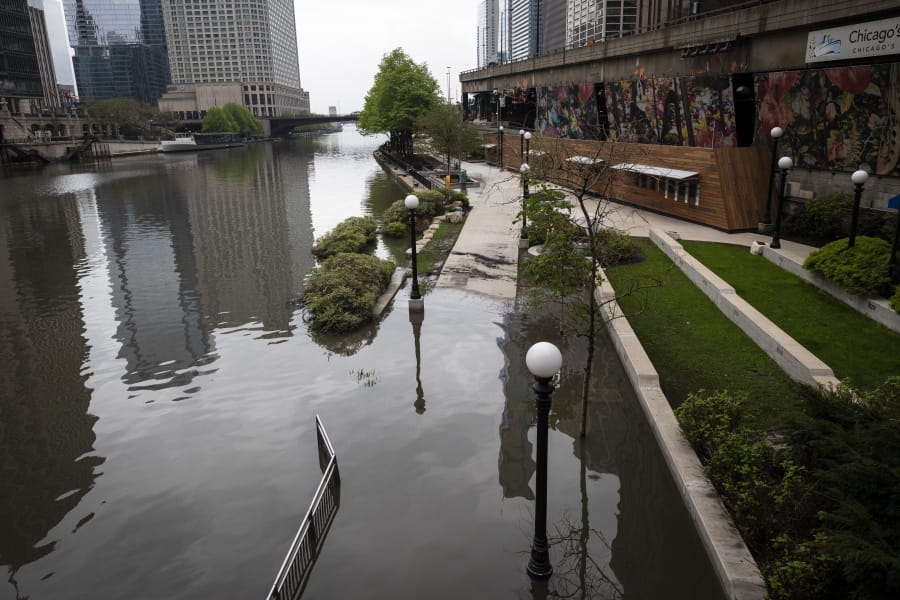 The Chicago River overflowed its banks and flooded the Riverwalk after overnight showers and thunderstorms across the city, Monday, May 18, 2020 in Chicago.