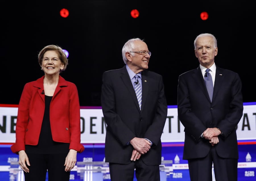 FILE - In this Feb. 25, 2020, file photo from left, Democratic presidential candidates, Sen. Elizabeth Warren, D-Mass., Sen. Bernie Sanders, I-Vt., former Vice President Joe Biden, and Sen. Amy Klobuchar, D-Minn., participate in a Democratic presidential primary debate in Charleston, S.C. Calls for pragmatic centrism helped Joe Biden clinch the Democratic presidential nomination. But they left many of the party&#039;s strongest liberals worried that little progress would be made toward their sweeping goals.