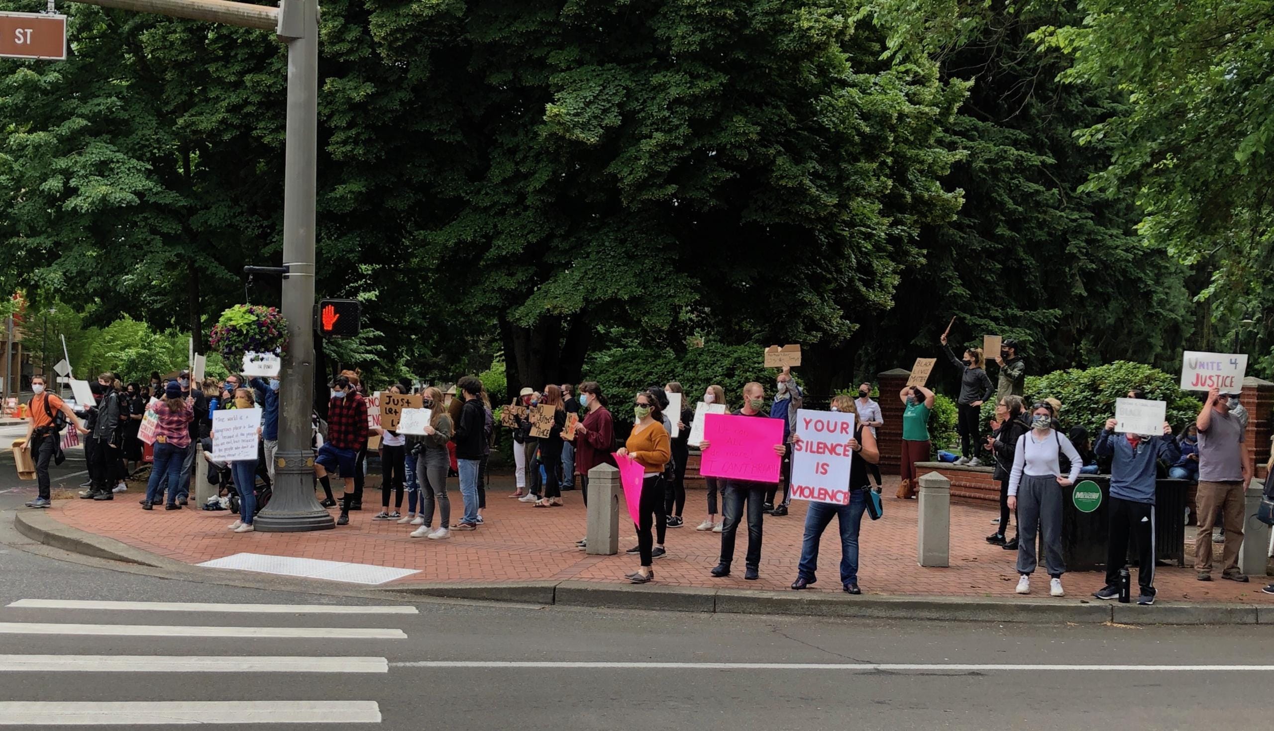 Demonstrators gathered at the corner of West 8th Street and Columbia on Sunday. It was part of protests in cities nationwide following the death of George Floyd in Minneapolis on May 25.