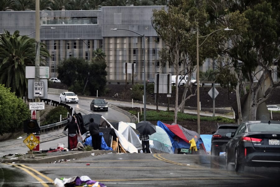 A homeless encampment, shown in January 2019, lines an offramp to the 110 freeway in downtown Los Angeles.