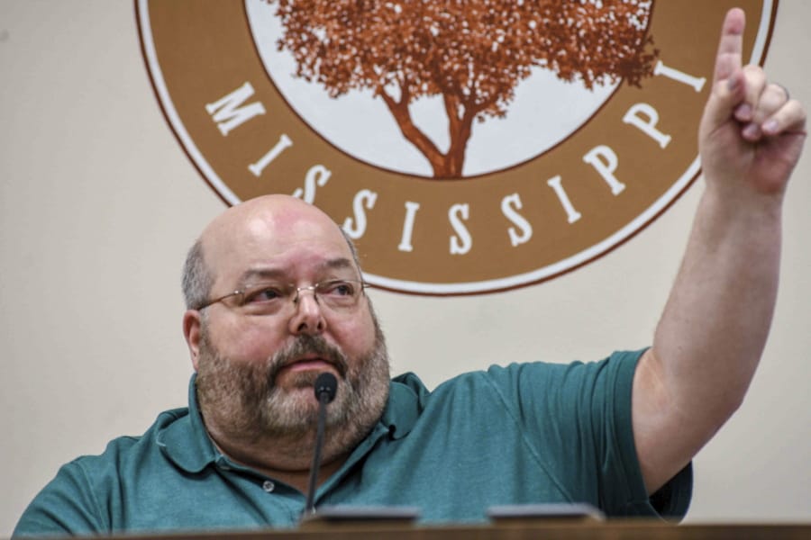 Petal Mayor Hal Marx raises his hand and refuses to resign at a special board of aldermen meeting at Petal City Hall, Thursday, May 28, 2020, in Petal, Miss., over comments he made about the death of Minneapolis man George Floyd at the hands of police, on social media.