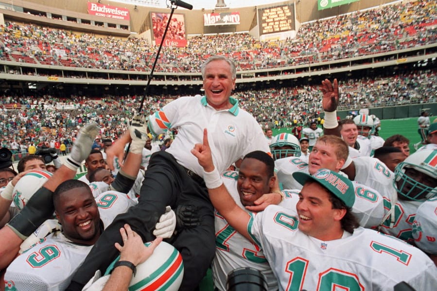 FILE - In this Nov. 14, 1993, file photo, Miami Dolphins coach Don Shula is carried on his team&#039;s shoulders after his 325th victory, against the Philadelphia Eagles in Philadelphia. Shula, who won the most games of any NFL coach and led the Miami Dolphins to the only perfect season in league history, died Monday, May 4, 2020, at his South Florida home, the team said. He was 90.